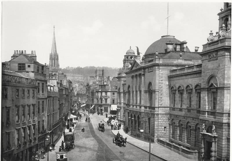 Georgian High Street with the Guildhall dome and carriages, Bath.